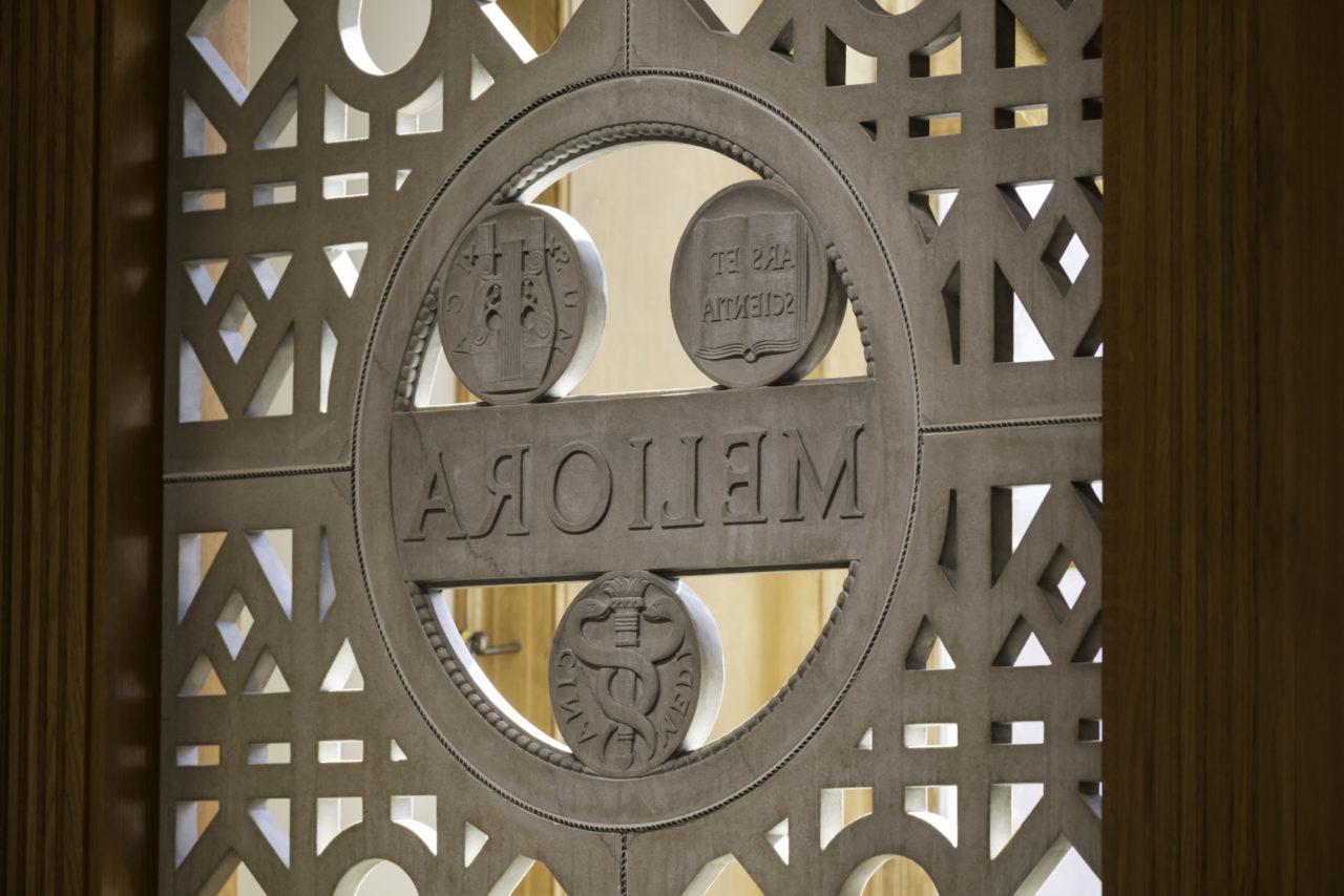 Meliora seal inside Hawkins-Carlson Room in Rush Rhees Library